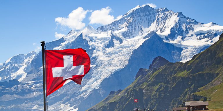 Swiss flag on the top of Mannlichen (Jungfrau region, Bern, Switzerland ...